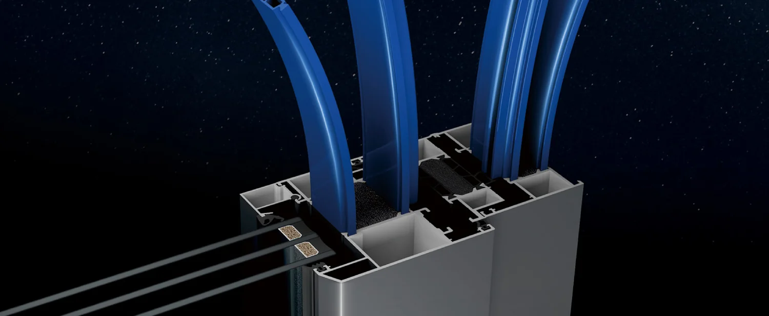 PA66 polyamide insulation strips being threaded into the chambers of an aluminium profile